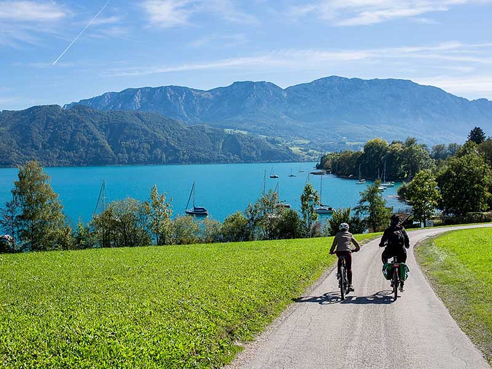 Mother and daughter cycle to Lake Attersee in Salzkammergut Region