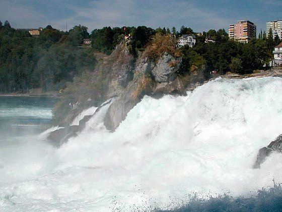 one of the largest water falls rush down the rocks at Schaffhausen
