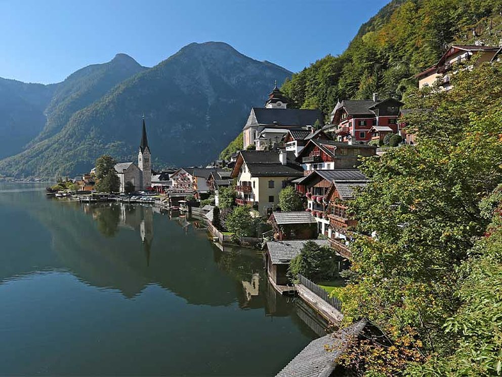 Hallstatt is situated at the lakeside, high mountains in the back