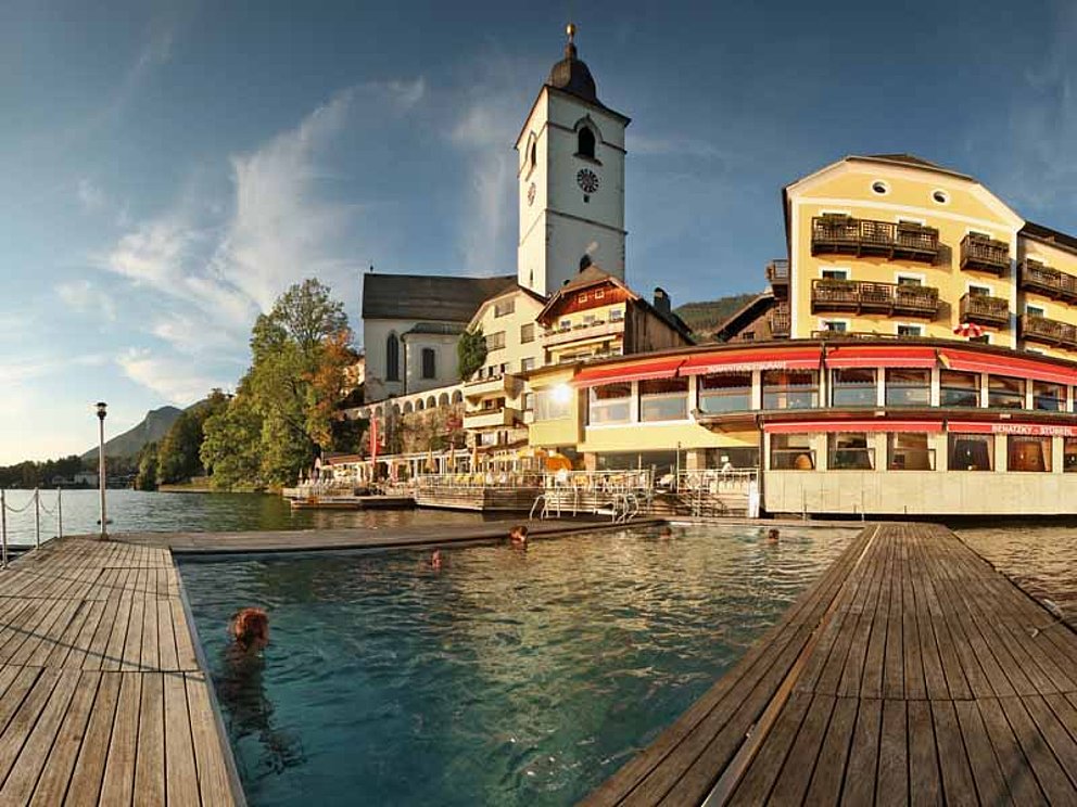 the heated outdoor pool of the Hotel Weißes Rössl, is part of Lake Wolfgangsee in Austria