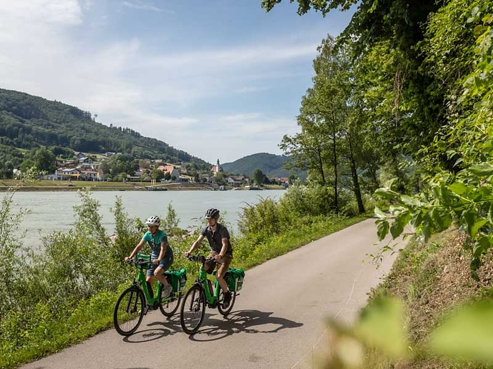 a couple enjoys the Danube Cycle Path at Upper Austria
