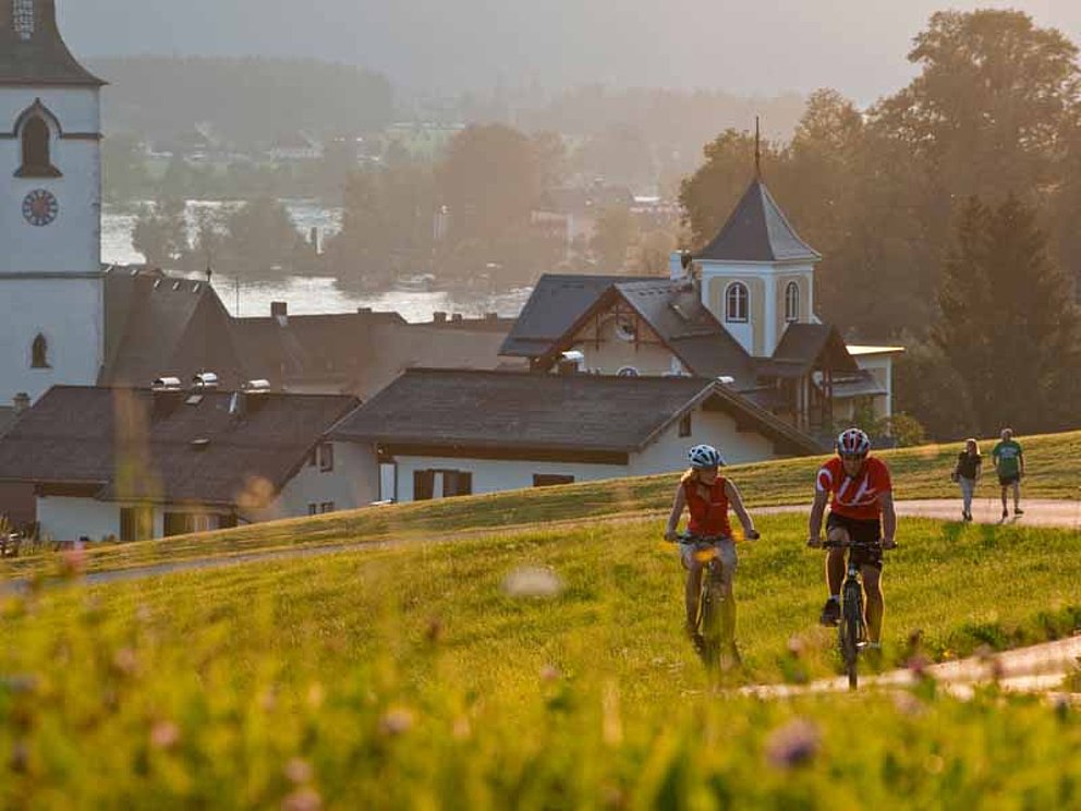 cyclists passing St. Wolfgang, near Lake Wolfgangsee