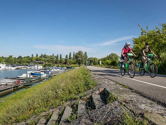 2 Cyclists ride along the Danbue River at Au