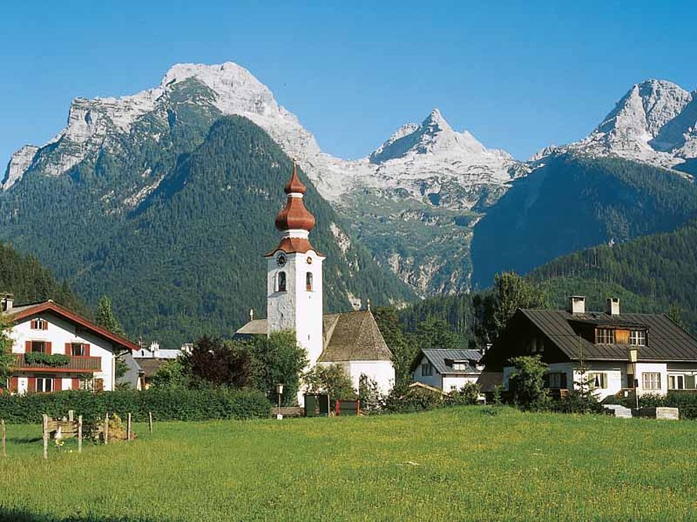 houses and church of Lofer with alpine summits in the back